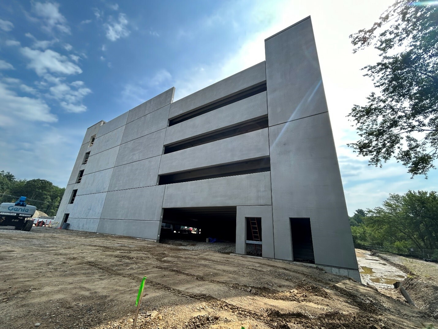 Ground view of a parking garage under construction.