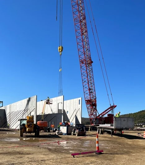 Precast Services using large cranes to erect large precast panels.